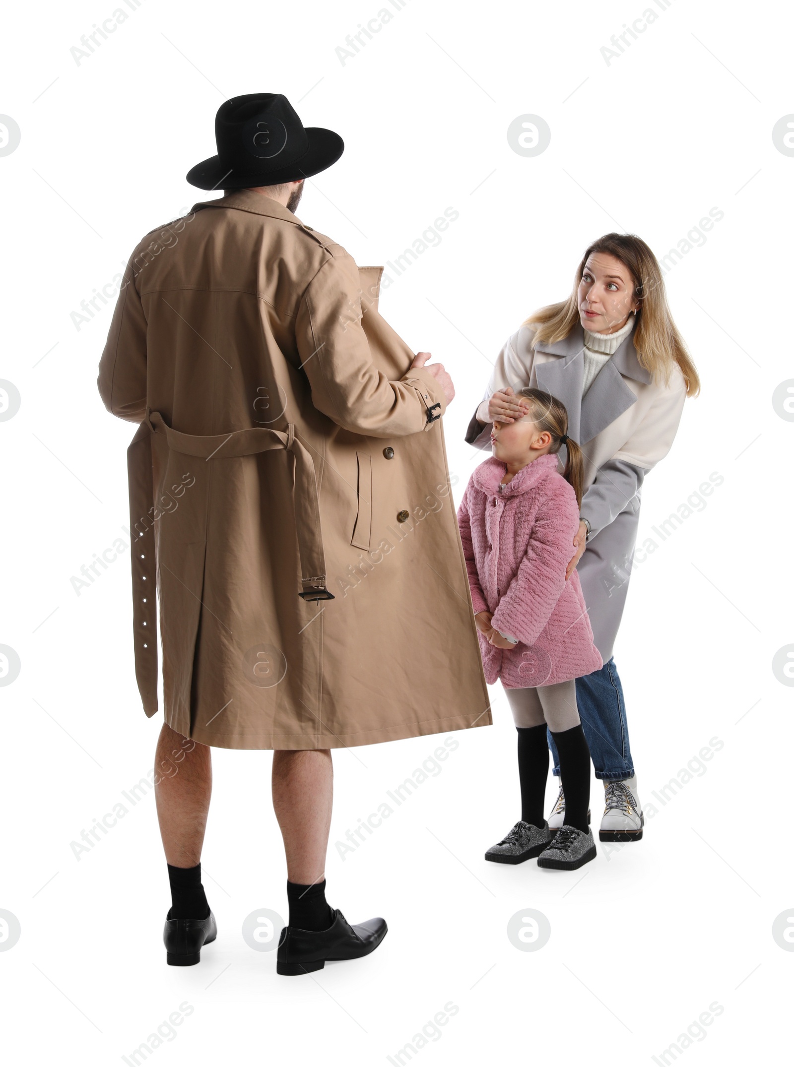 Photo of Exhibitionist exposing naked body under coat in front of mother with child isolated on white