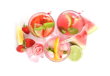 Photo of Glasses of tasty refreshing drinks on white background, top view