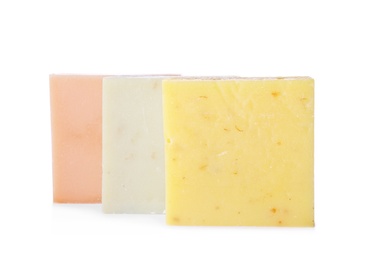 Photo of Different handmade soap bars on white background