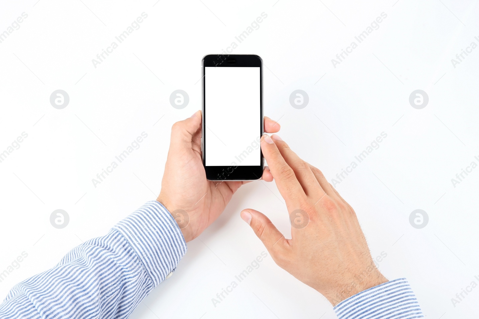 Photo of Young man holding mobile phone with blank screen in hand on white background