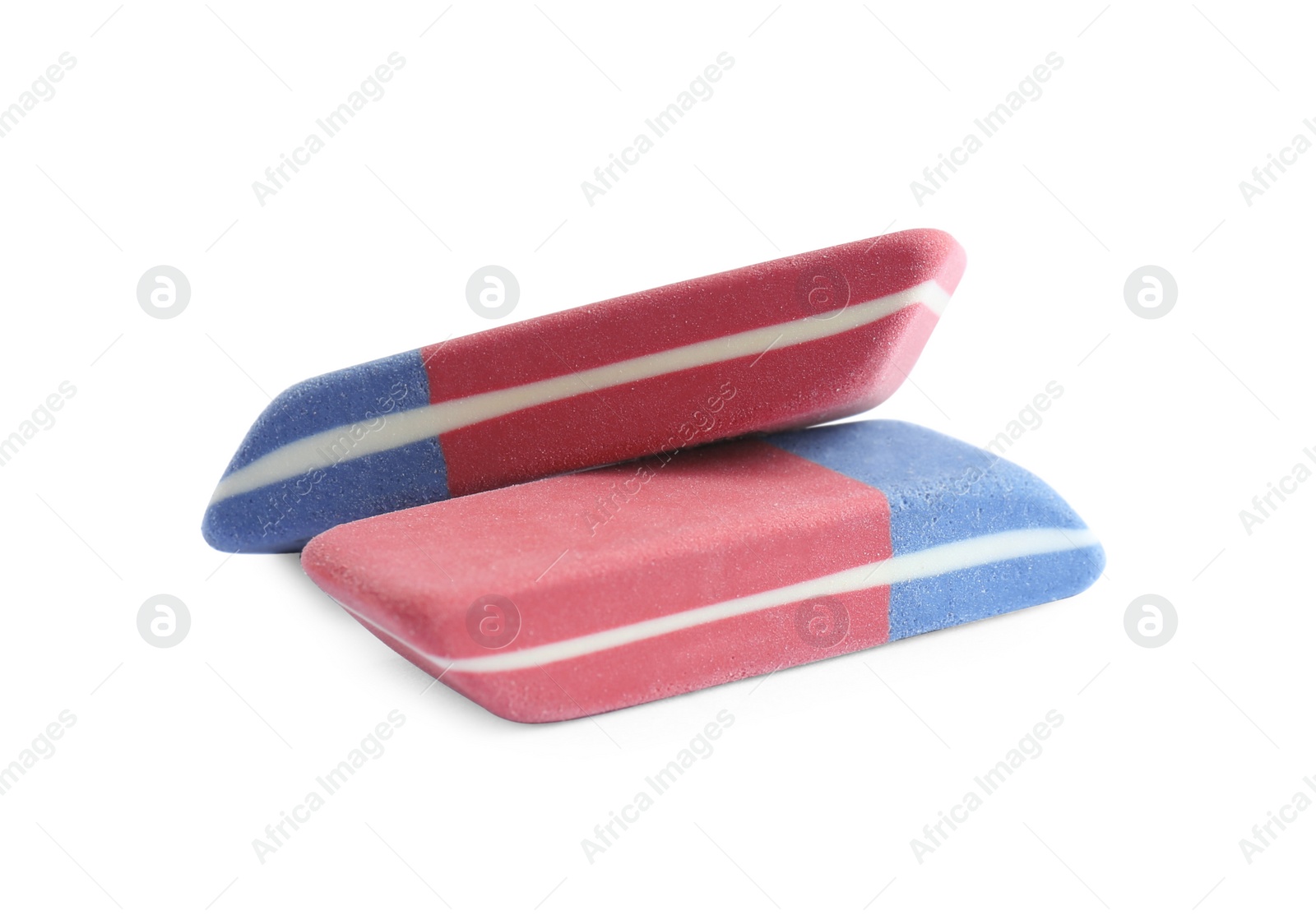 Photo of New double erasers isolated on white. School stationery
