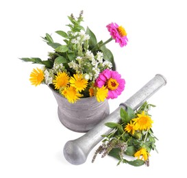 Mortar with different flowers and pestle on white background