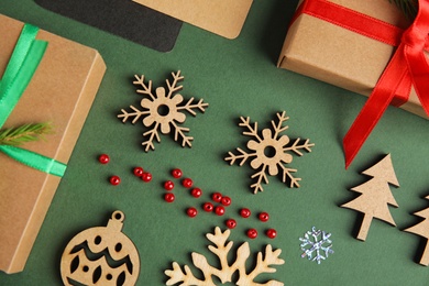 Photo of Flat lay composition with Christmas decor on dark green background