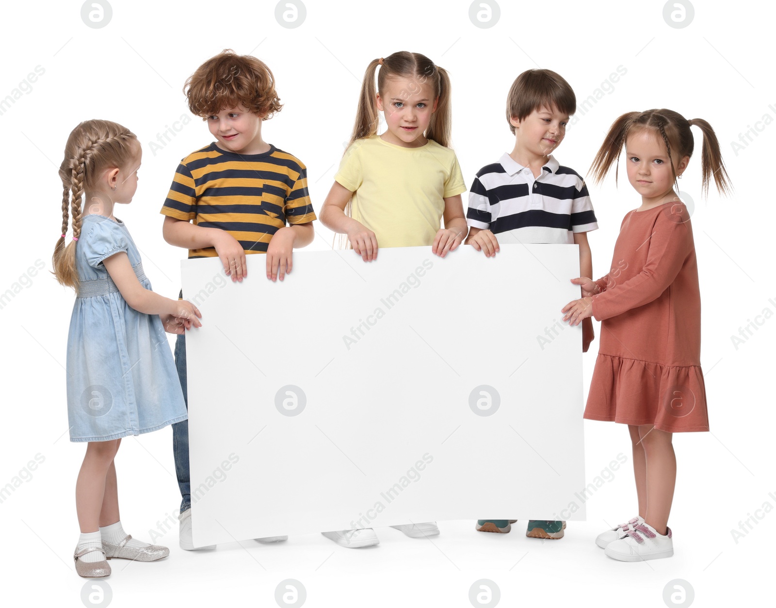Photo of Group of children with blank poster on white background. Mockup for design
