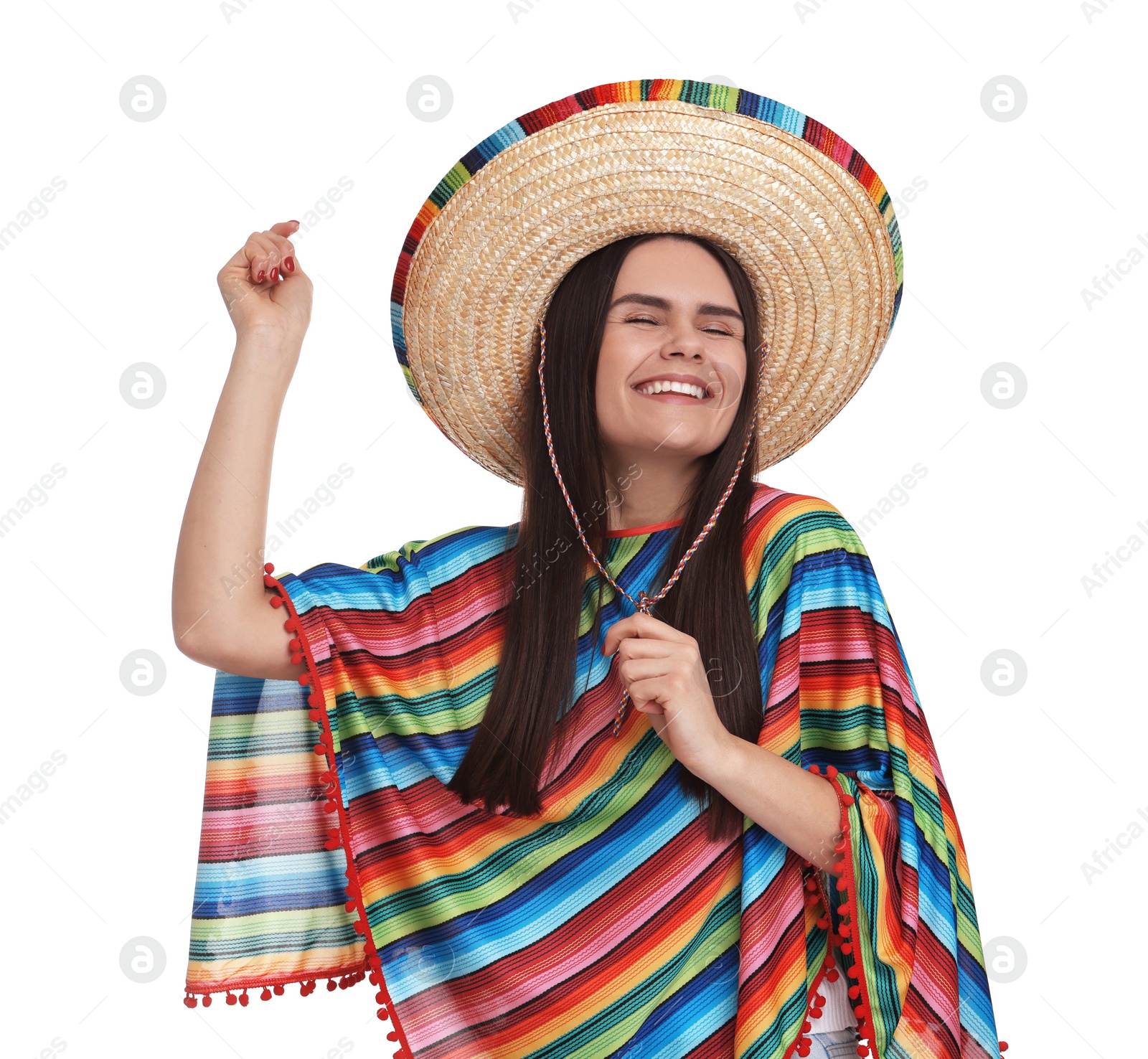 Photo of Young woman in Mexican sombrero hat and poncho dancing on white background