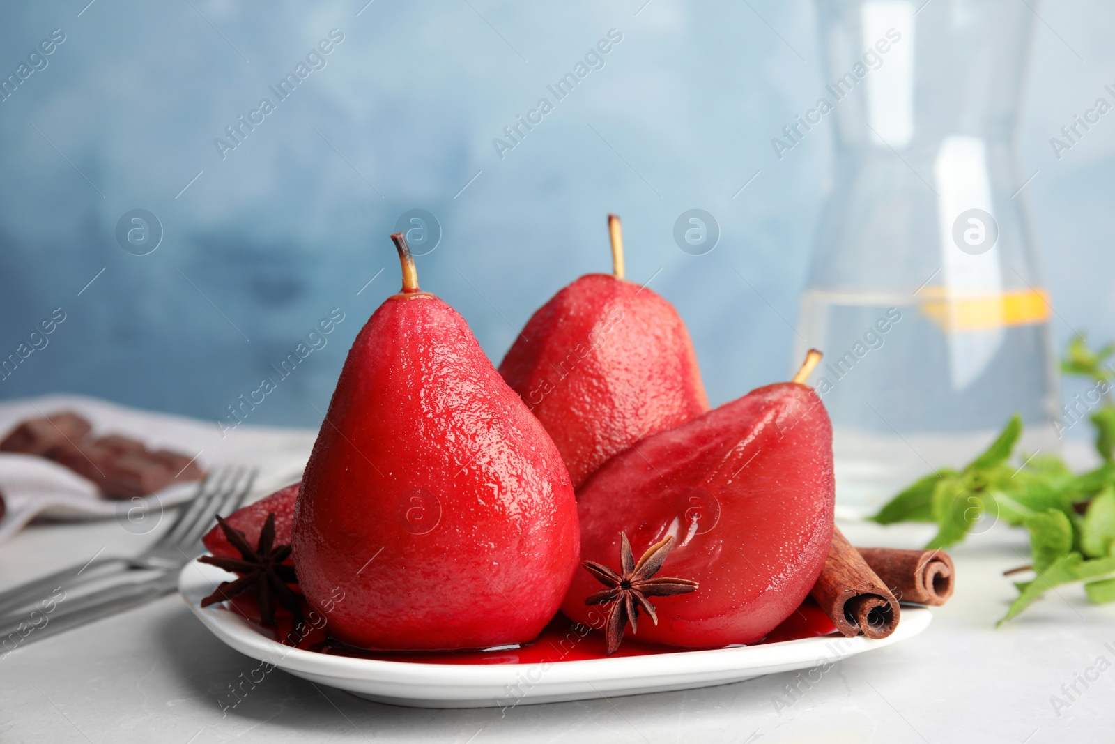 Image of Delicious mulled wine poached pears served on table