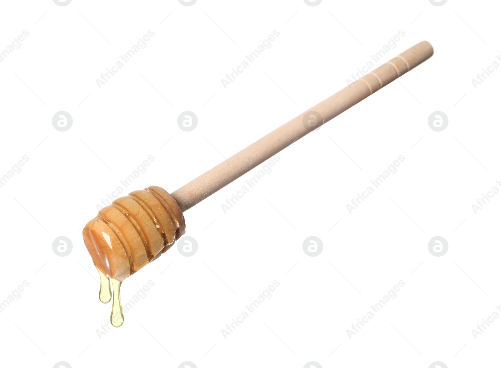 Photo of Natural honey dripping from dipper on white background