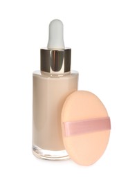 Bottle of skin foundation with sponge isolated on white. Makeup product