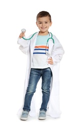 Cute little child in doctor coat with stethoscope on white background