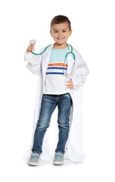 Photo of Cute little child in doctor coat with stethoscope on white background