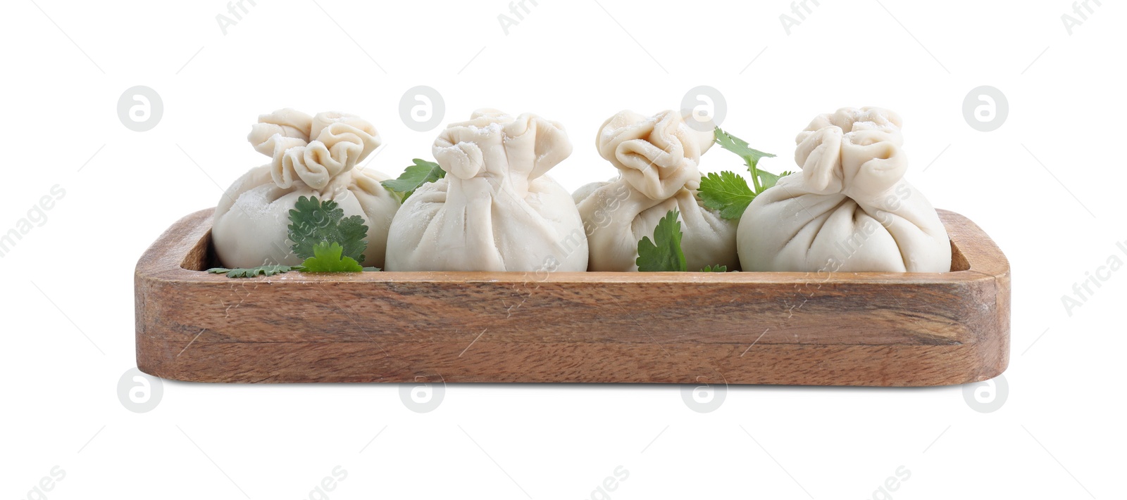 Photo of Tray with uncooked khinkali (dumplings) and parsley isolated on white. Georgian cuisine