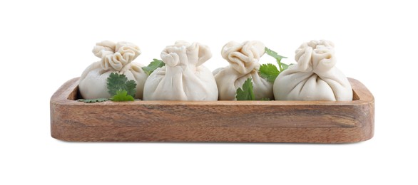 Tray with uncooked khinkali (dumplings) and parsley isolated on white. Georgian cuisine