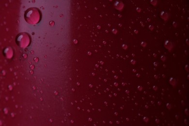 Photo of Texture of red lipstick with water drops as background, macro view