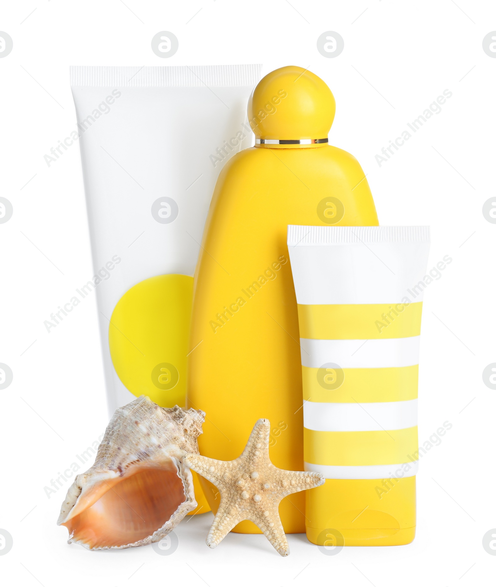 Photo of Different suntan products, starfish and seashell on white background