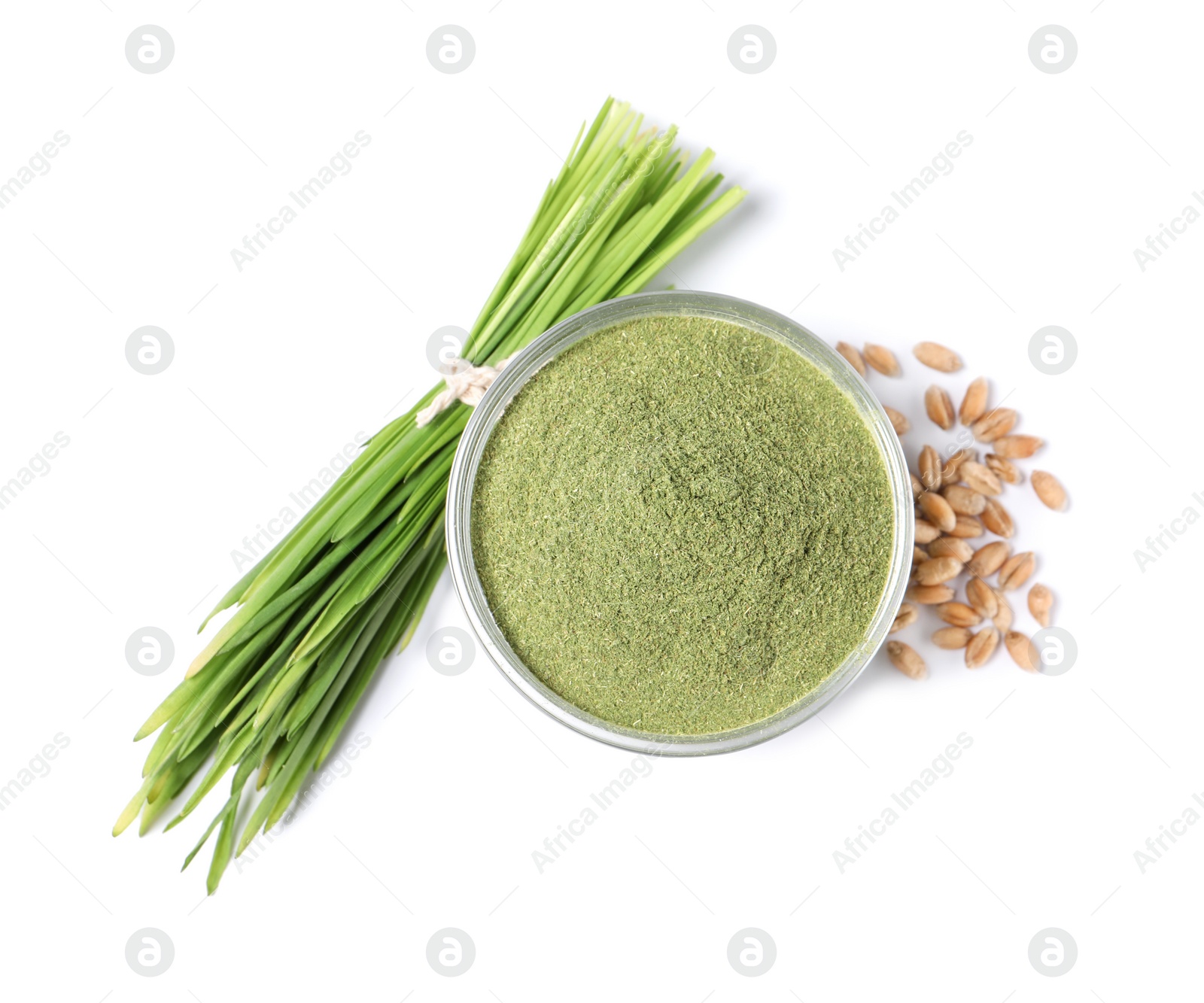 Photo of Wheat grass powder in glass bowl, seeds and fresh sprouts isolated on white, top view