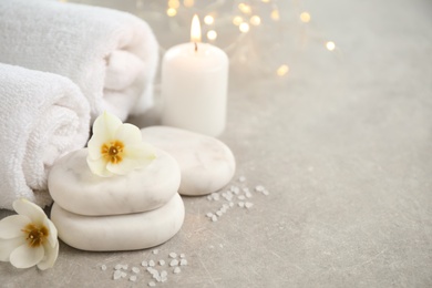 Photo of Spa composition with towels on light background, space for text