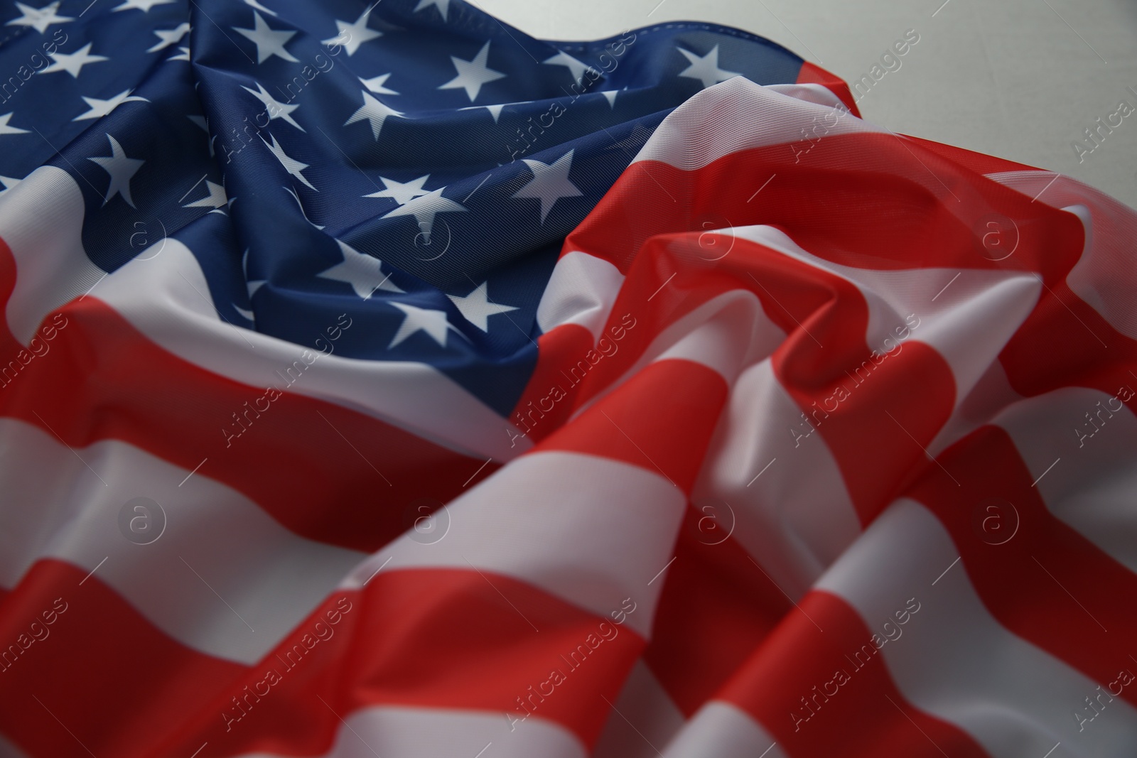 Photo of Flag of USA on white table, closeup