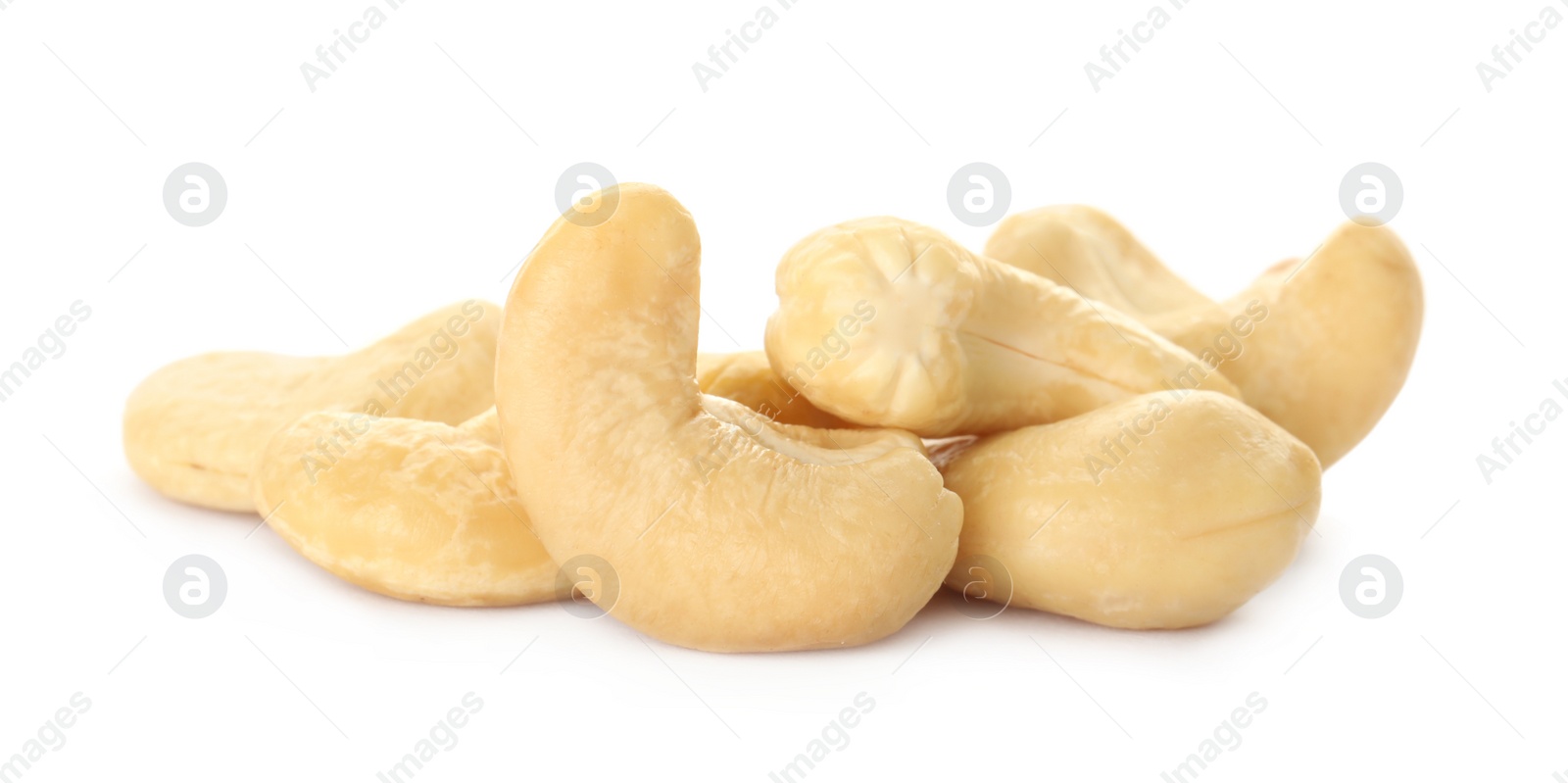 Photo of Pile of tasty organic cashew nuts isolated on white