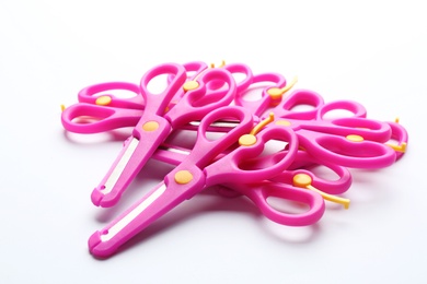 Heap of training scissors on white background