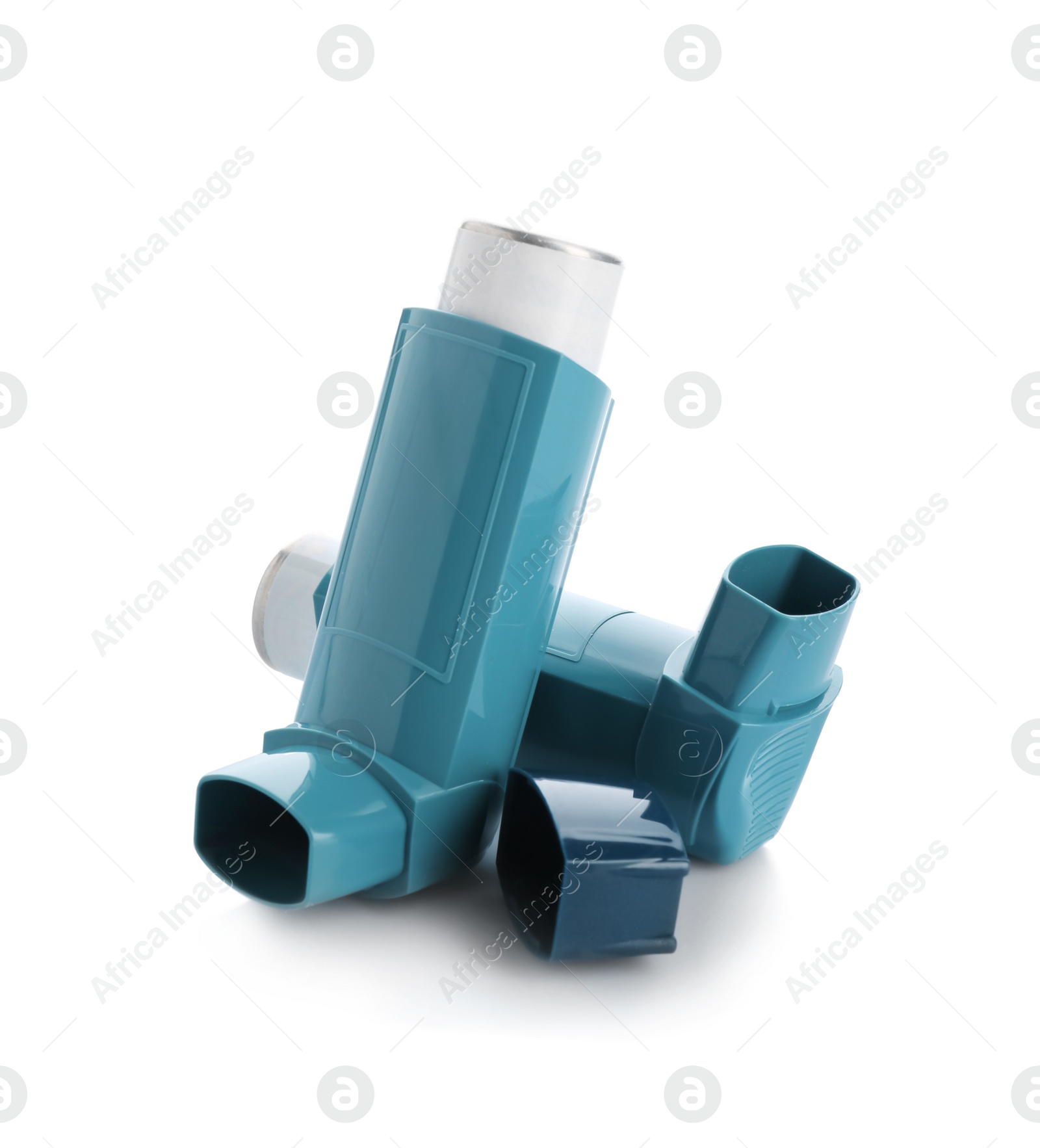 Photo of Two portable asthma inhalers on white background