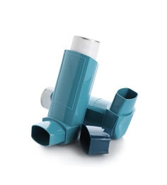 Two portable asthma inhalers on white background