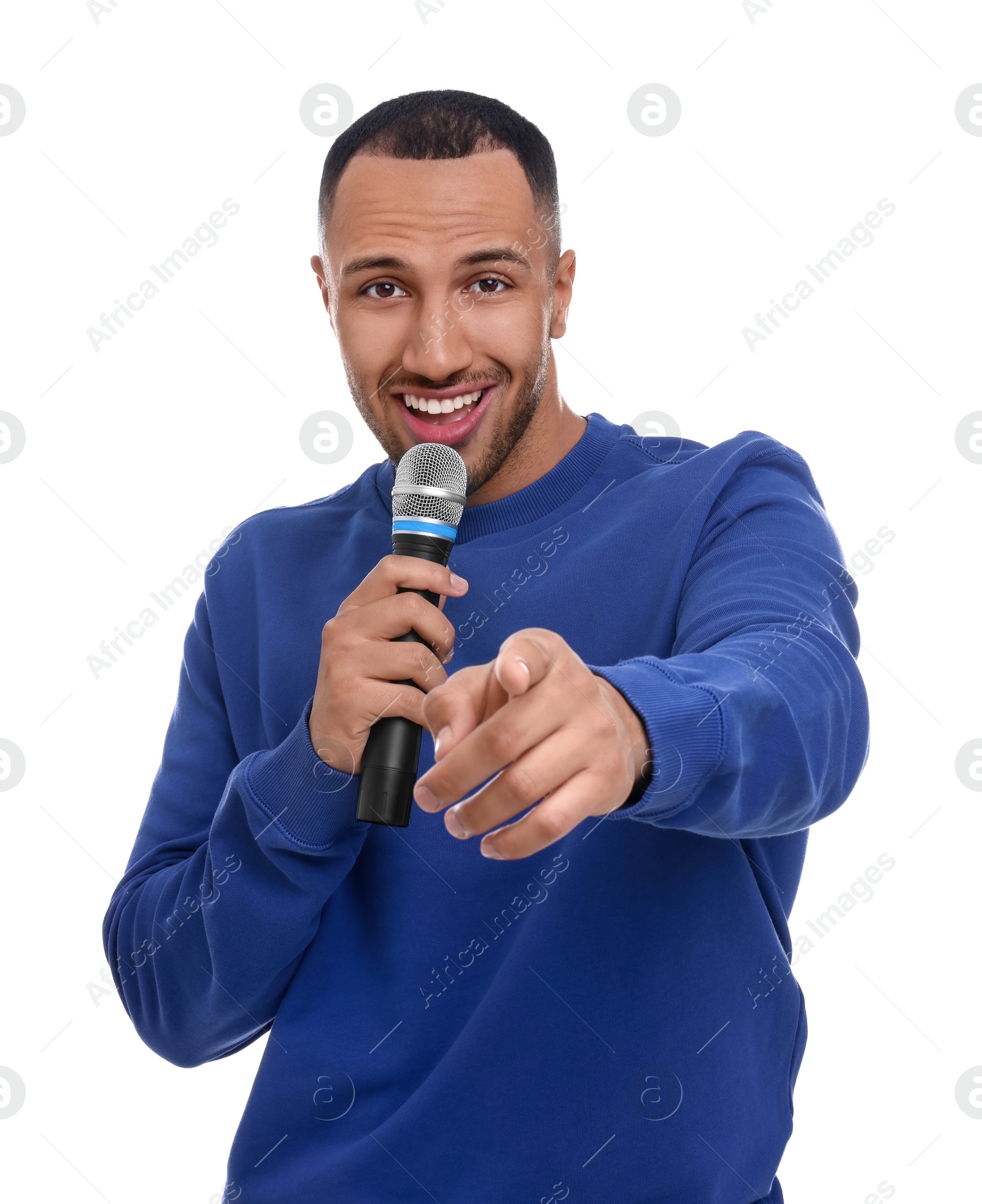 Photo of Handsome man with microphone singing on white background