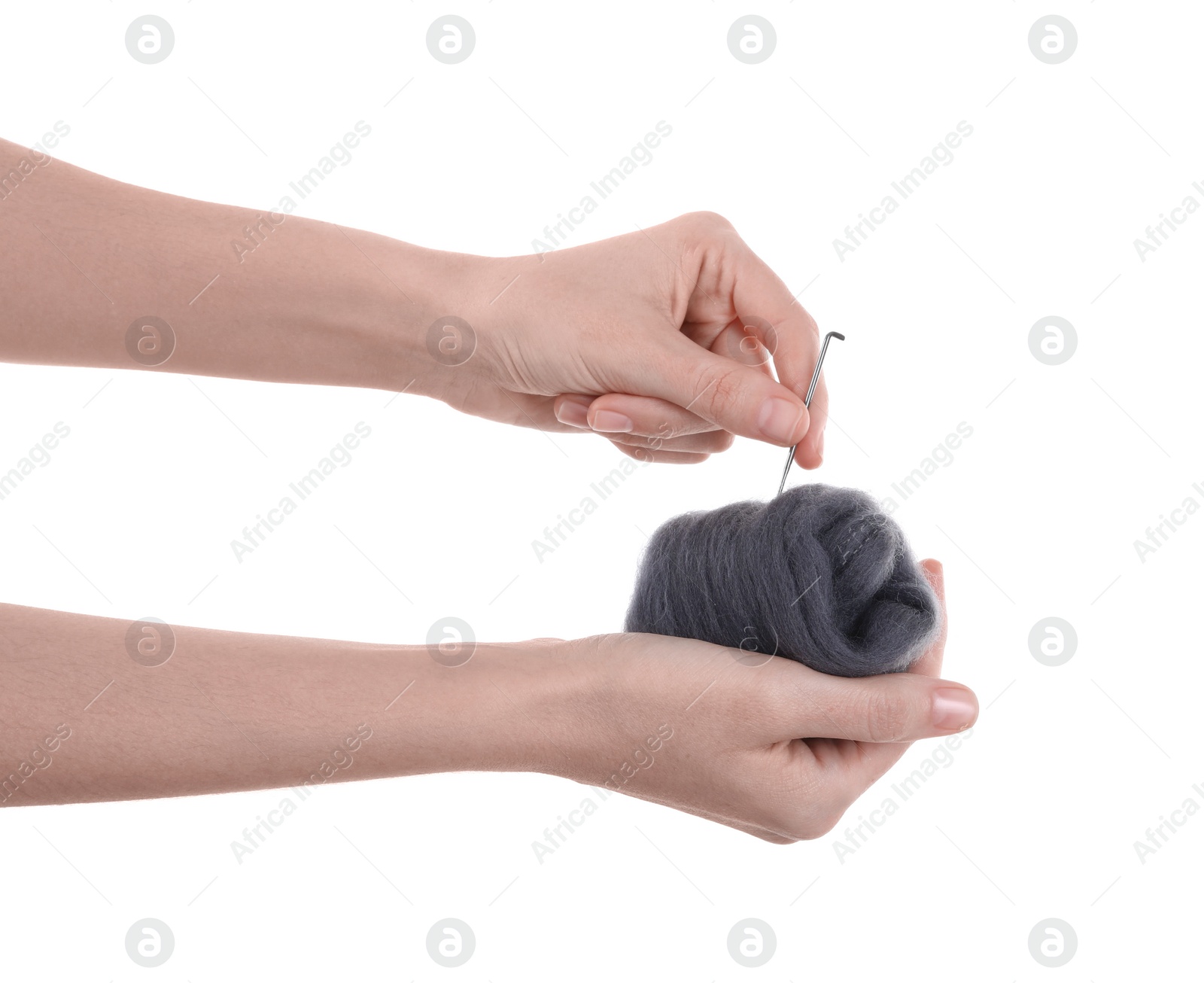 Photo of Woman needle felting from wool on white background, closeup