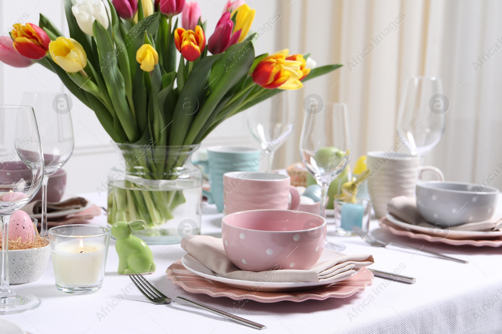 Photo of Festive table setting with beautiful flowers. Easter celebration