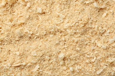 Photo of Dry natural sawdust as background, top view