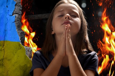Image of Little girl praying and wall of ruined building painted in color of national flag on fire. Stop war in Ukraine