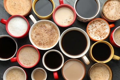 Many cups of different coffees on table, flat lay