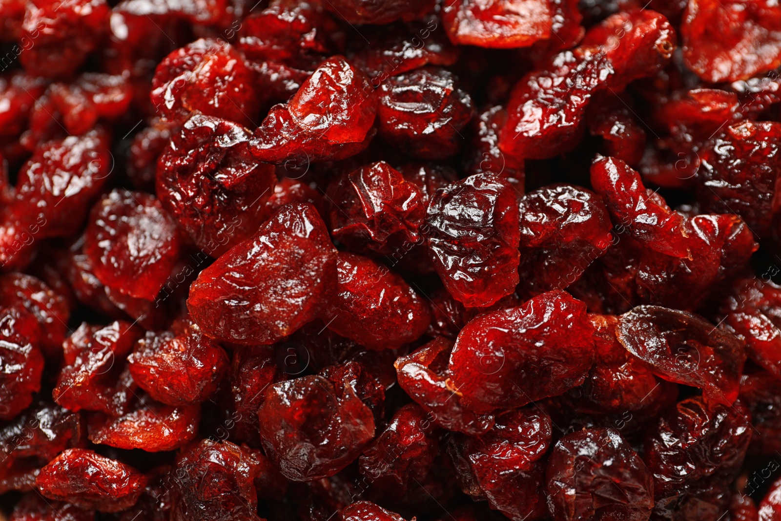 Photo of Tasty cranberries as background, top view. Dried fruits as healthy snack