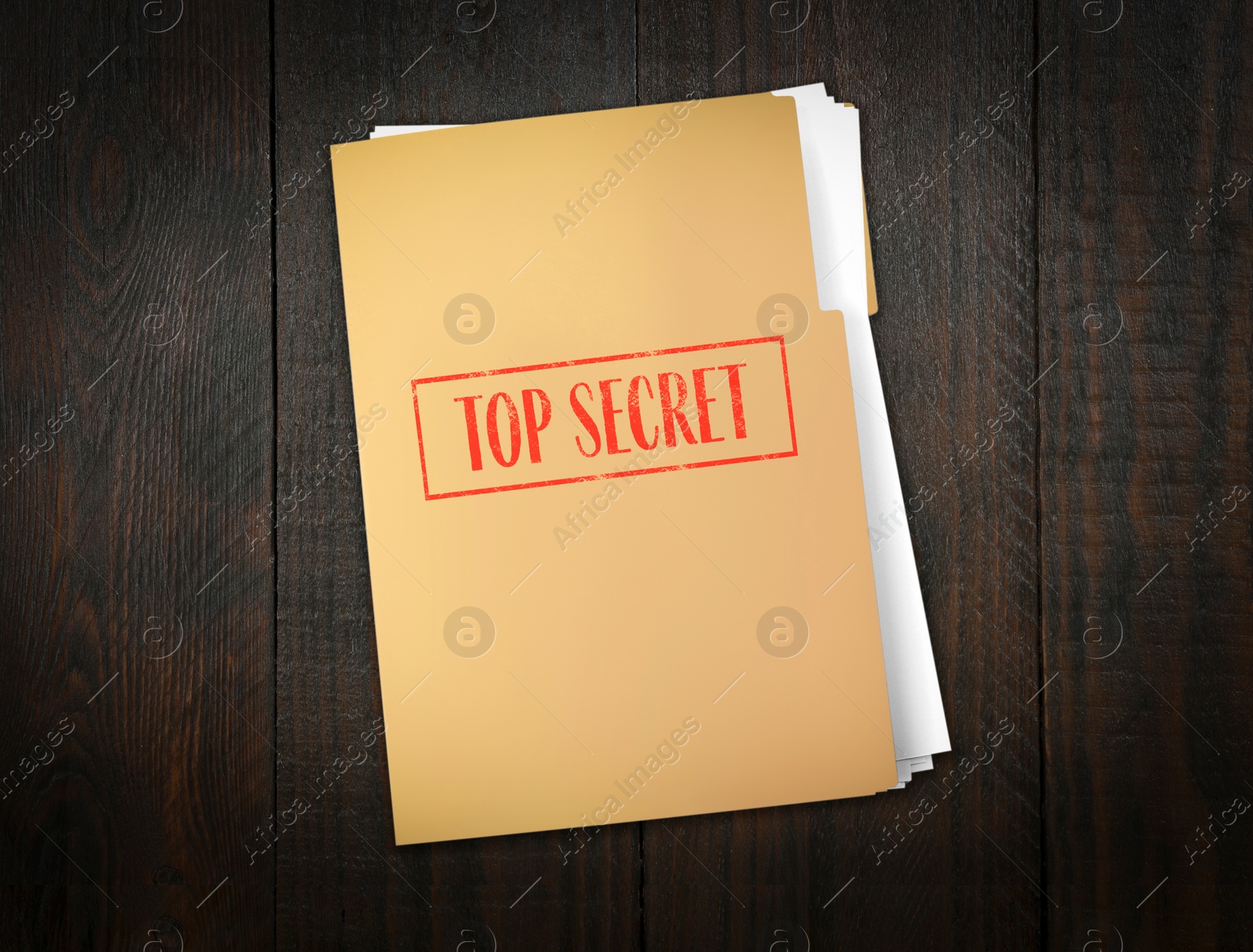 Image of Top Secret stamp. File with documents on wooden table, top view