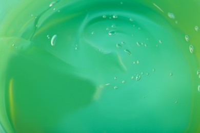 Photo of Aloe gel as background, closeup. Cosmetic product