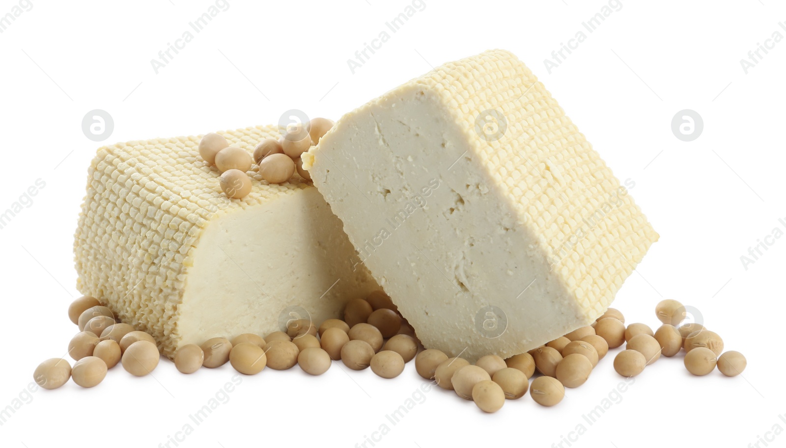 Photo of Pieces of delicious tofu and soy on white background