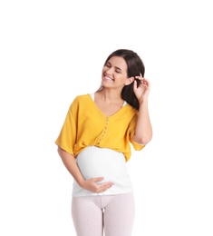 Happy pregnant woman posing on white background