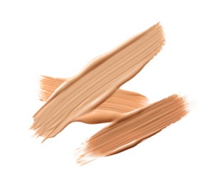 Samples of liquid skin foundations on white background, top view