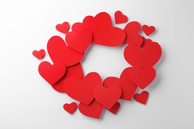 Photo of Composition with red hearts on white background, top view