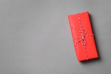 Beautiful gift box on gray background, top view