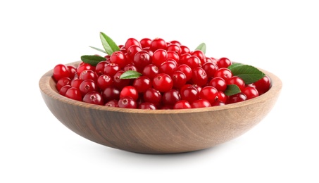 Photo of Fresh ripe cranberries with leaves in bowl isolated on white