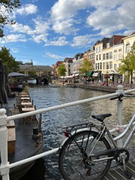 Photo of Beautiful view of buildings near canal in city under cloudy sky