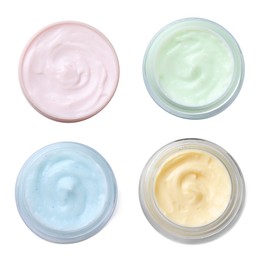 Image of Set with jars of body cream on white background, top view