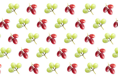 Pattern of red and green grapes on white background