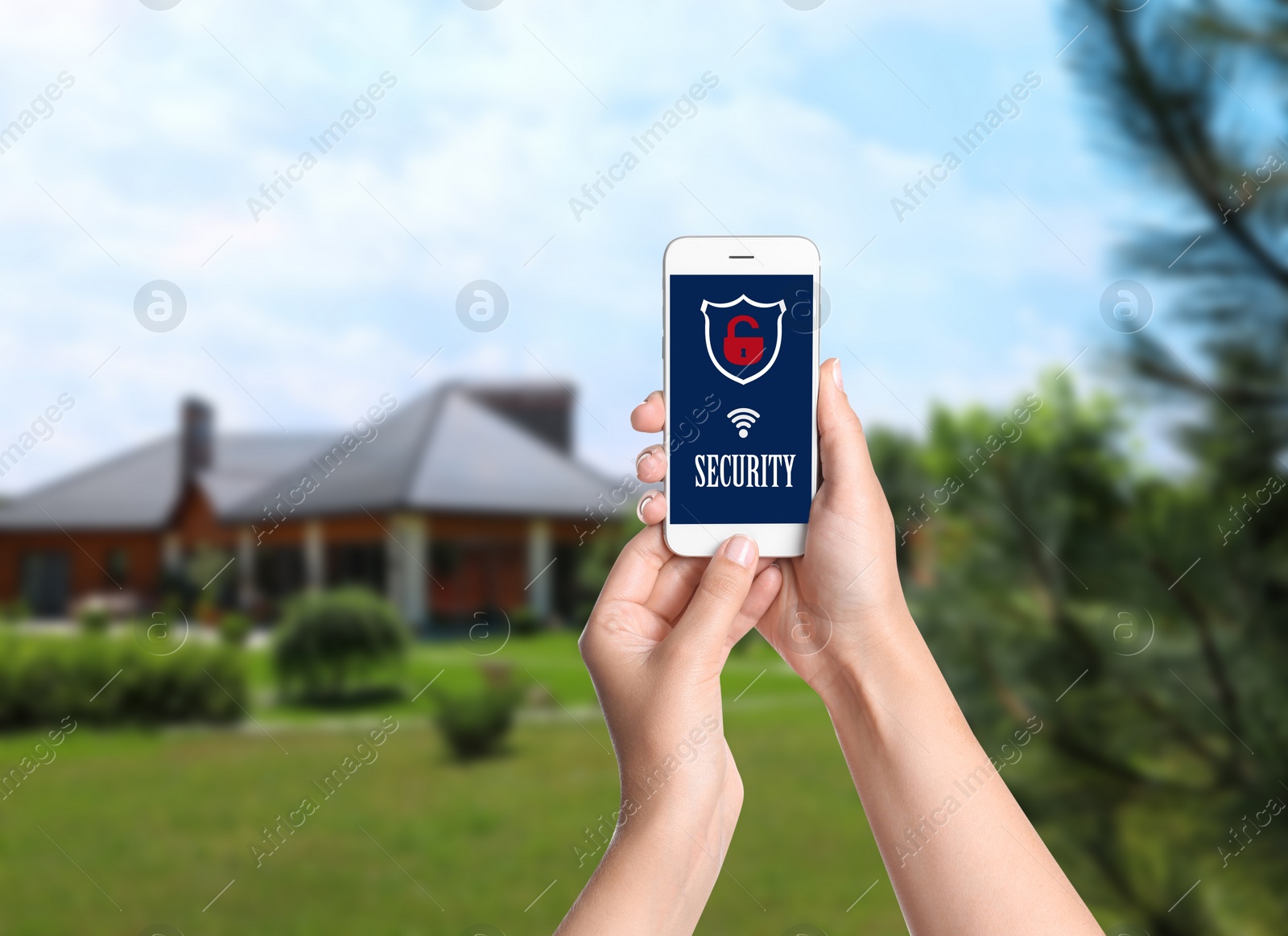 Image of Alarm system. Woman using phone outdoors, space for text