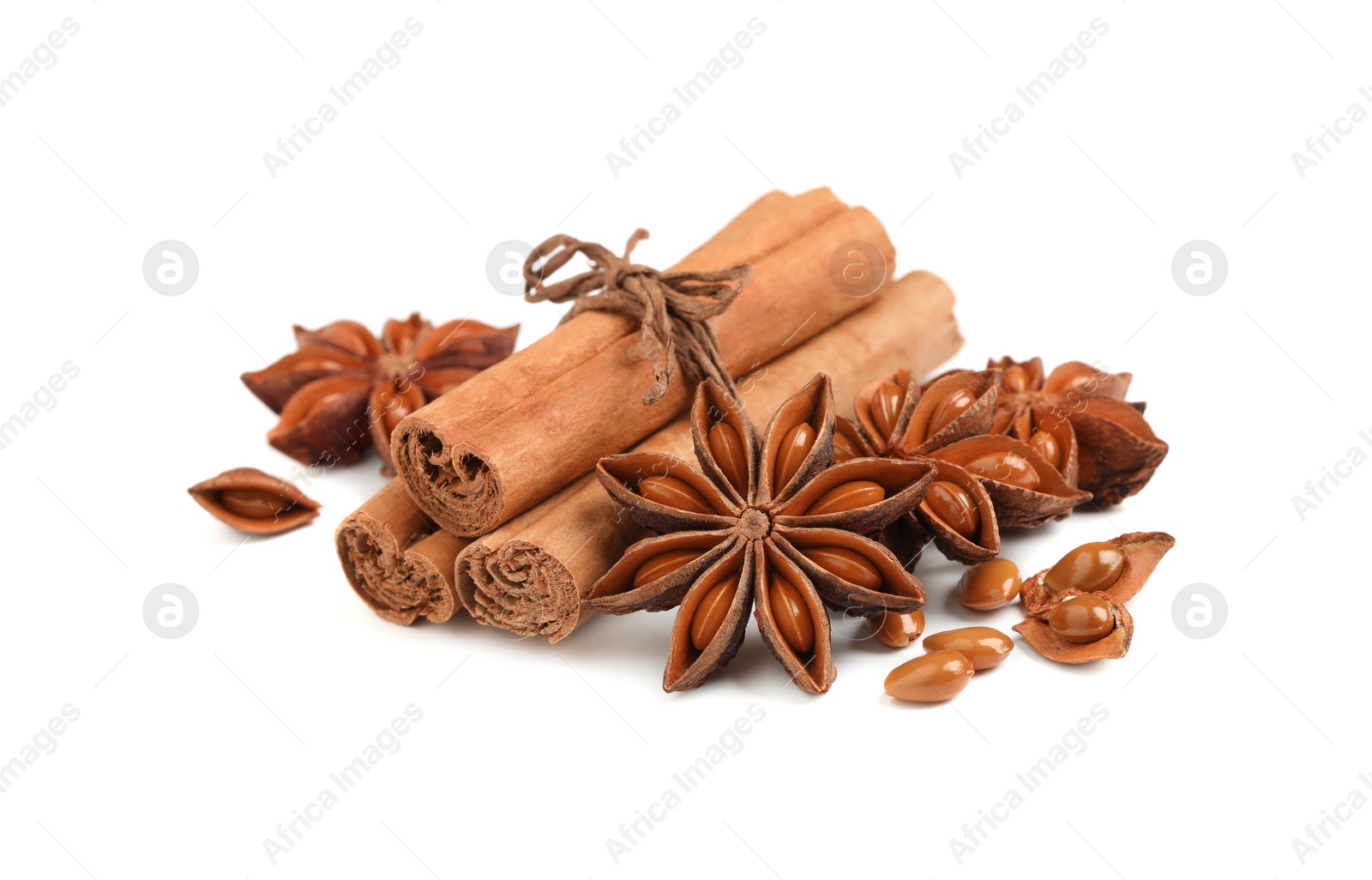 Photo of Dry anise stars and cinnamon sticks on white background