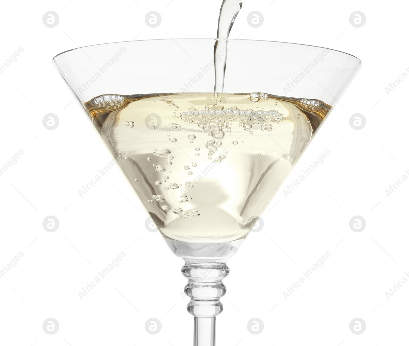 Photo of Pouring martini from bottle into glass on white background