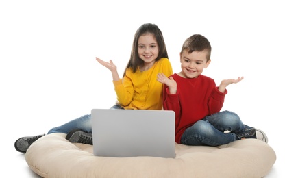 Photo of Little children using video chat on laptop against white background