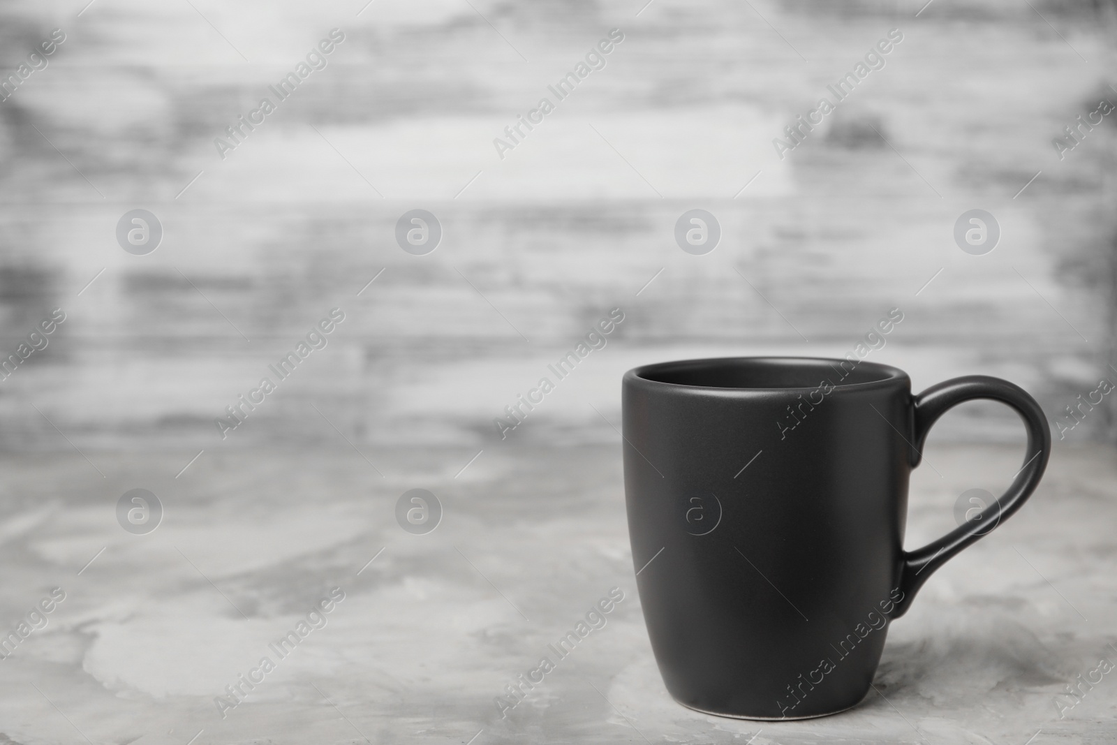 Photo of Black ceramic cup on table