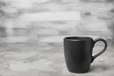 Black ceramic cup on table