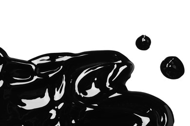 Photo of Blots of black glossy paint on white background, top view